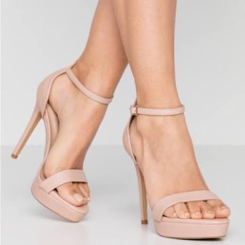 Never worn! Nude pink platform Aldo strappy sandals retail for $98